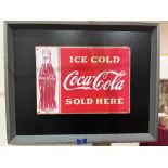 A reproduction enamel sign 'Coca Cola'. Framed. The sign 10' x 14'