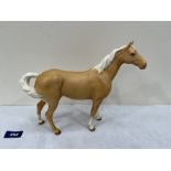 A Beswick matt glazed horse. 8¼' high