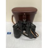 A pair of Carl Zeiss Jenoptem 7x50w binoculars in leather case. Serial no. 4700669. Optics good