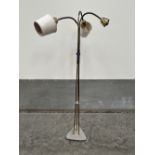 A 1950s gilt brass tubular lamp standard with three lights on flexible stems. 57' high