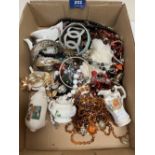 A box of costume jewellery and small ceramics