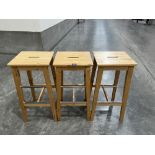 A set of three barstools