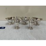 A George V five piece silver cruet set to comprise a pair of navette shaped salts; a pair of