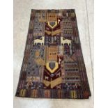 An eastern rug, woven with animals to the wool pile. 75' x 42½'