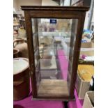 An oak shop display case. 27' high