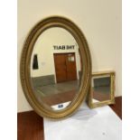 A Georgian style gilt oval wall mirror and a small frame with associated mirror plate