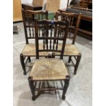 Three Lancashire spindle-back chairs with rush seats