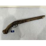 An 18th century French flintlock holster pistol. 19' long. Damage, losses