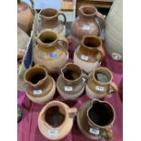 A collection of earthenware jugs