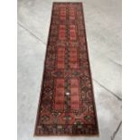 A red ground carpet runner. 108' long