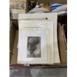 A box of unframed etchings and watercolour drawings