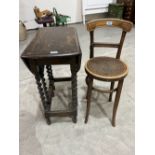 A bentwood high chair and an oak barleytwist dropleaf table