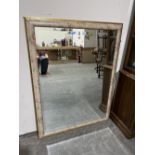 A modern wall mirror with bevelled plate. 54' x 40'