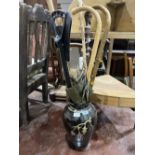 Walking sticks and a pottery vase