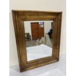 An antiqued gilt framed mirror 21½' x 17½'