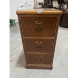 A burrwood veneered filing cabinet of three drawers. 41½' high