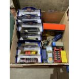 A box of collector's diecast model vehicles, some boxed