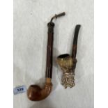 A continental briar pipe of bent form with naturalistic wood stem and horn mouthpiece 10' long;