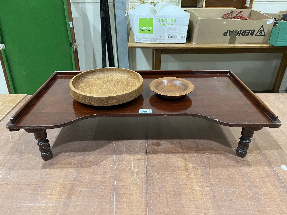 A mahogany bed table and two treen bowls