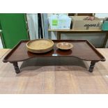 A mahogany bed table and two treen bowls
