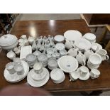 An extensive collection of white glazed dinner and teaware, various factories and designs