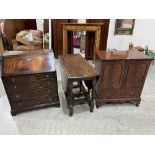 An oak gateleg table on barleytwist legs. 41½' wide; a writing bureau and a T.V. cabinet (3)