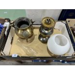 A small brass cauldron and an oillamp