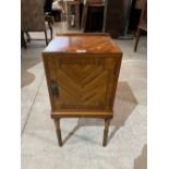 A mahogany line inlaid and crossbanded bedside cabinet on reeded legs