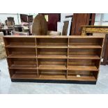 An open bookcase of twelve shelves. 78' wide; together with a glazed bookcase. 54' wide