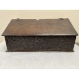 An early 18th century oak table box, the carved front dated 1713. 32' wide