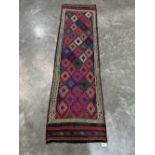 A Suzni Kilim carpet runner. 2.22m x 0.62m