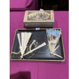 A Japanese lacquer tray, a Spanish decorated box and two ivory fans (A.F.)