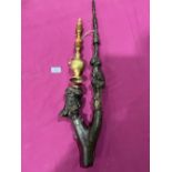 A continental carved wood tobacco pipe, with metal mounts and turned stem, 26' long; the lot to