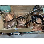 A copper coal scuttle, saucepans and other copperware