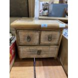 A small bamboo chest of three drawers. 13'w x 12'h