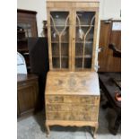 A walnut bureau bookcase on cabriole legs. 30' wide