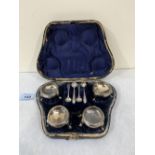 A morocco cased set of four Victorian silver salts and spoons. Sheffield 1865. Maker: Richard Martin