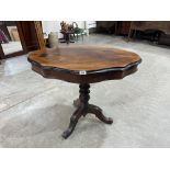 A French walnut tripod table with shaped top. 35' wide