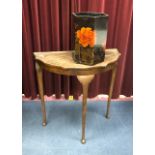 A MAHOGANY SERPENTINE SIDE TABLE AND A PAPER BIN