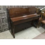 A MODERN UPRIGHT PIANO