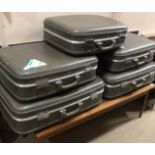 A SET OF FIVE VINTAGE SUITCASES