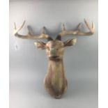 A PLASTIC WALL MOUNTING STAG'S HEAD