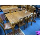 A MAHOGANY DINING TABLE AND CHAIRS