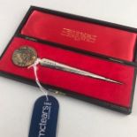 A QEII SILVER JUBILEE PAPER KNIFE BY STUART DEVLIN