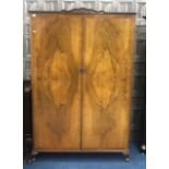 A WALNUT TWO DOOR WARDROBE