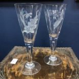 A SET OF EIGHT ETCHED CHAMPAGNE GLASSES