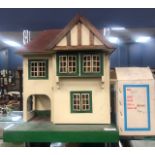 A VINTAGE DOLLS HOUSE WITH ACCESSORIES