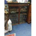 A MAHOGANY TWO DOOR BOOKCASE