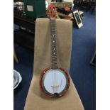 A MUSIMA FOUR STRING BANJO