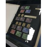 AN ALBUM OF INDIAN STAMPS